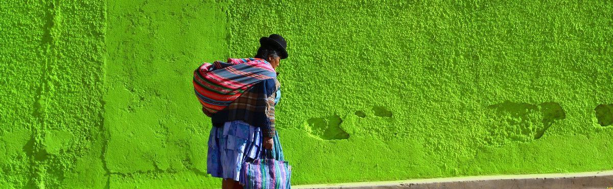 Woman walking green background 2 - Bolivia
