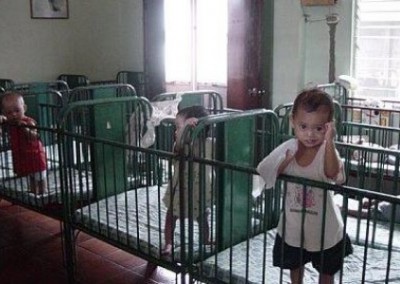 Babies in cots Work in an Orphanage in the Philippines