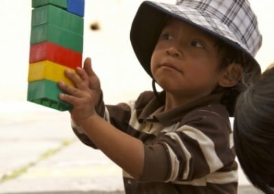 Child with lego education outreach for child workers Ecuador