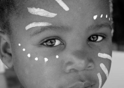 Child with painted face photography and conservation in Kruger South Africa