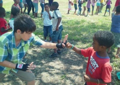 Children building for orphans Belize
