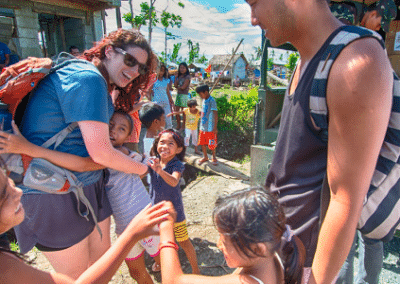 Children hugging volunteers Work in an Orphanage in the Philippines