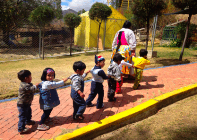 Children playing family community development Bolivia