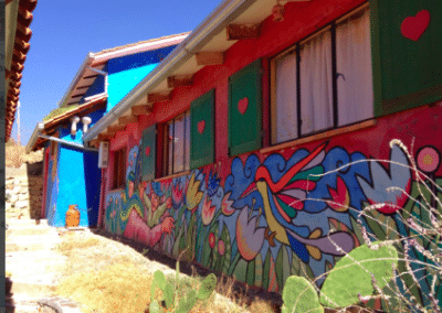 Colourful mural family community development Bolivia