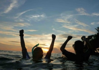 Divers coming up family reef conservation Belize