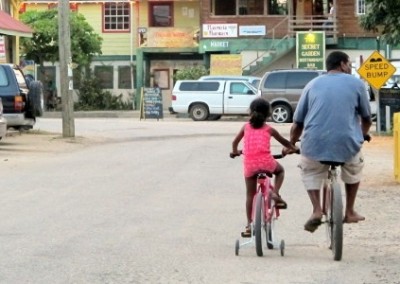 Father and daughter bikes social work Belize