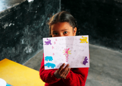 Girl with drawing Child Development Volunteering in India