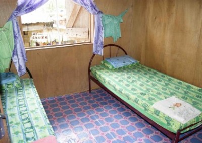 Green bedroom family volunteering community empowerment in Borneo