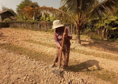 Khmer lady digging Building and Garden Volunteer in Cambodia