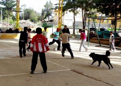 Kids playing footbal sports coaching and community work Bolivia