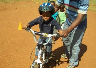 Learning to ride a bike Day Care Centre for HIV AIDS Orphans in Swaziland