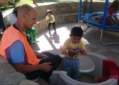 Michael volunteer with young boy Sports and Community work Bolivia