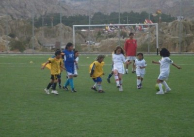 Playing football on pitch sports coaching and community work Bolivia