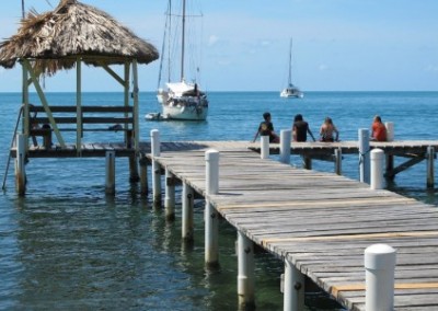 Sitting on a jetty family reef conservation Belize