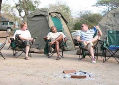 Sitting outside tents Volunteer Building with Kruger Safari in Swaziland