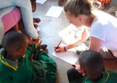 Teaching in Swaziland volunteer demonstrating maths at homework club