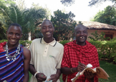 Three locals smiling Rural Volunteer Teaching in Tanzania