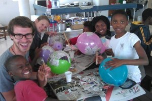 family volunteers teaching arts and crafts for pre-school children in South Africa