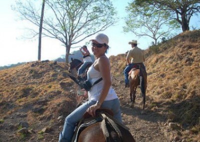 Volunteer on horseback community empowerment Costa Rica