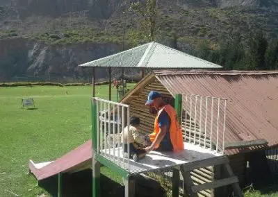 Volunteer on slide with child Sports and Community work Bolivia