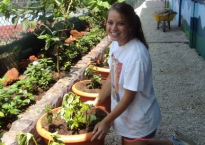 Volunteer potting plants family community beautification Costa Rica