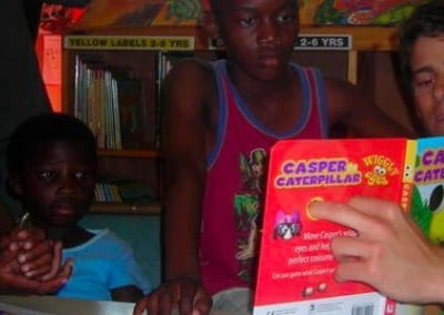 Volunteer reading with children community teaching South Africa