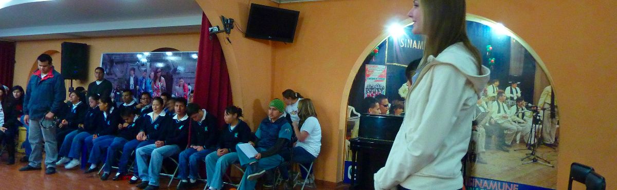 Volunteer speaking in the hall Integrated Music Dance and Art therapy Ecuador