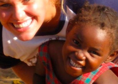 Volunteer with young girl Teaching and Community Work in Zambia