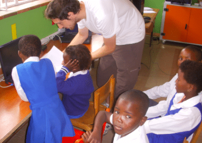 Volunteer working with children Wild Coast computer literacy and arts South Africa