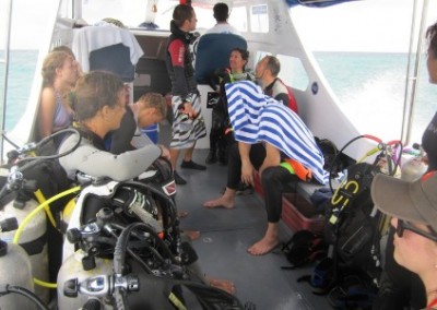 Volunteers on boat coral reef conservation and diving in Borneo