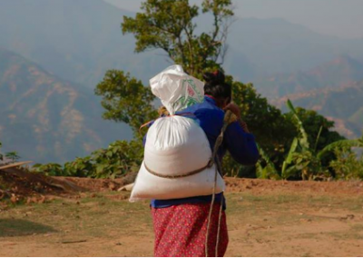 Woman carrying sack Day Care Center and Education Support in Nepal