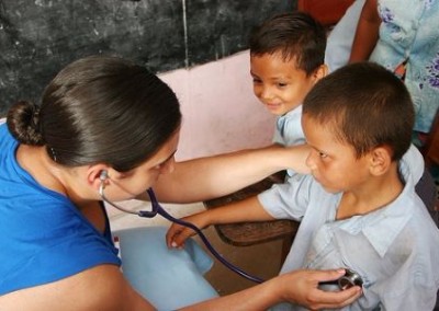 doctor checking childrens breathing