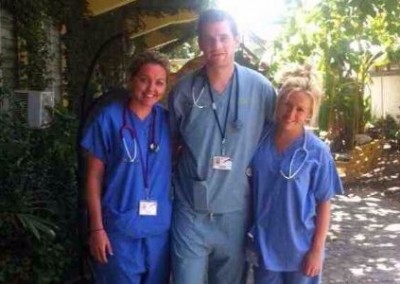 doctors in scrubs outside belize hospital