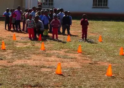 Explaining the concept of a relay race sports volunteering in Swaziland