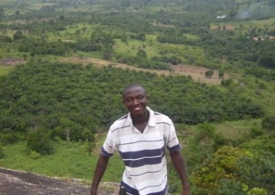 Ghanaian man stood on rock Nonprofit Development Internship in Ghana