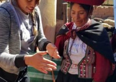 Two women outside Healthy Kitchens Peru