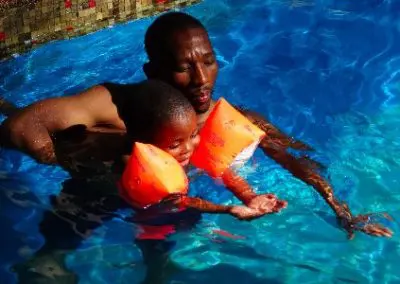 Volunteer abroad in Swaziland sports project Menzie teaching arms