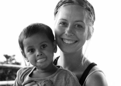 Volunteer with local child Family volunteering Nepal