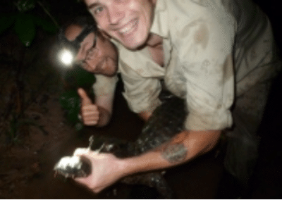 Volunteers catching croc environmental conservation Peru