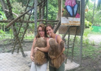 Volunteers holding sloths sea turtle conservation Costa Rica