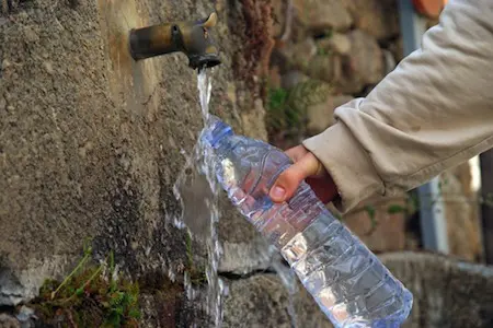 local refilling water bottle at an outdoor tap