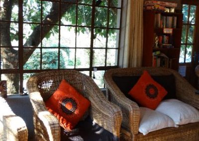 Cozy living room with a comfortable sofa and warm lighting.