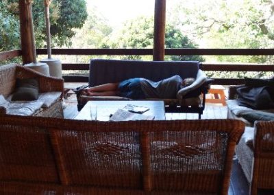 A volunteer relaxing in a cozy accommodation space.