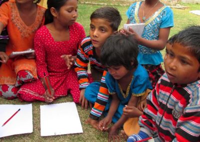 Children writing Child Development Volunteering in India