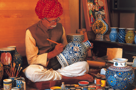 Buy local man painting pots