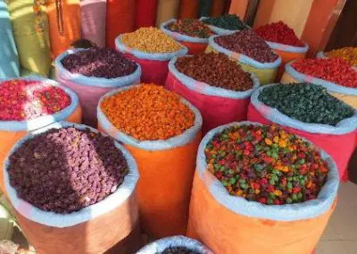 bags of colourful dried spices on a street market in india