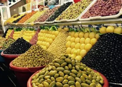 array of colourful fruit and veg on the street market in india