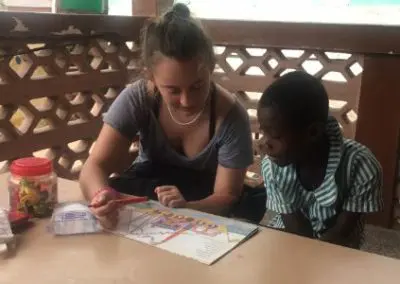 Participant practicing reading with students