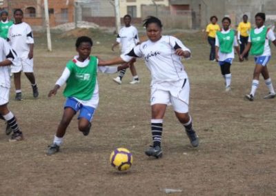 Girl football team playing