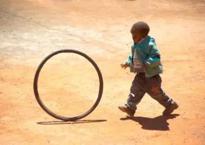 Little boy playing with hula hoop